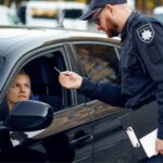 Cop checking a female driver's license